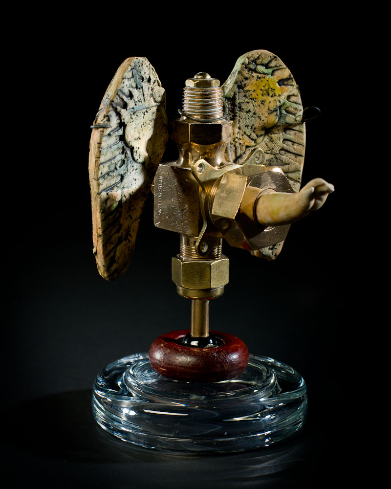 Benediction assemblage with clay and found objects by Leslie Ann McQuaide