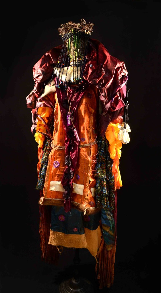 Shamanic Vestments For A Fire Priestess assemblage 2015 by Leslie Ann McQuaide with animals skins and re purposed thrift store clothing, jewelry and lampbase and shade